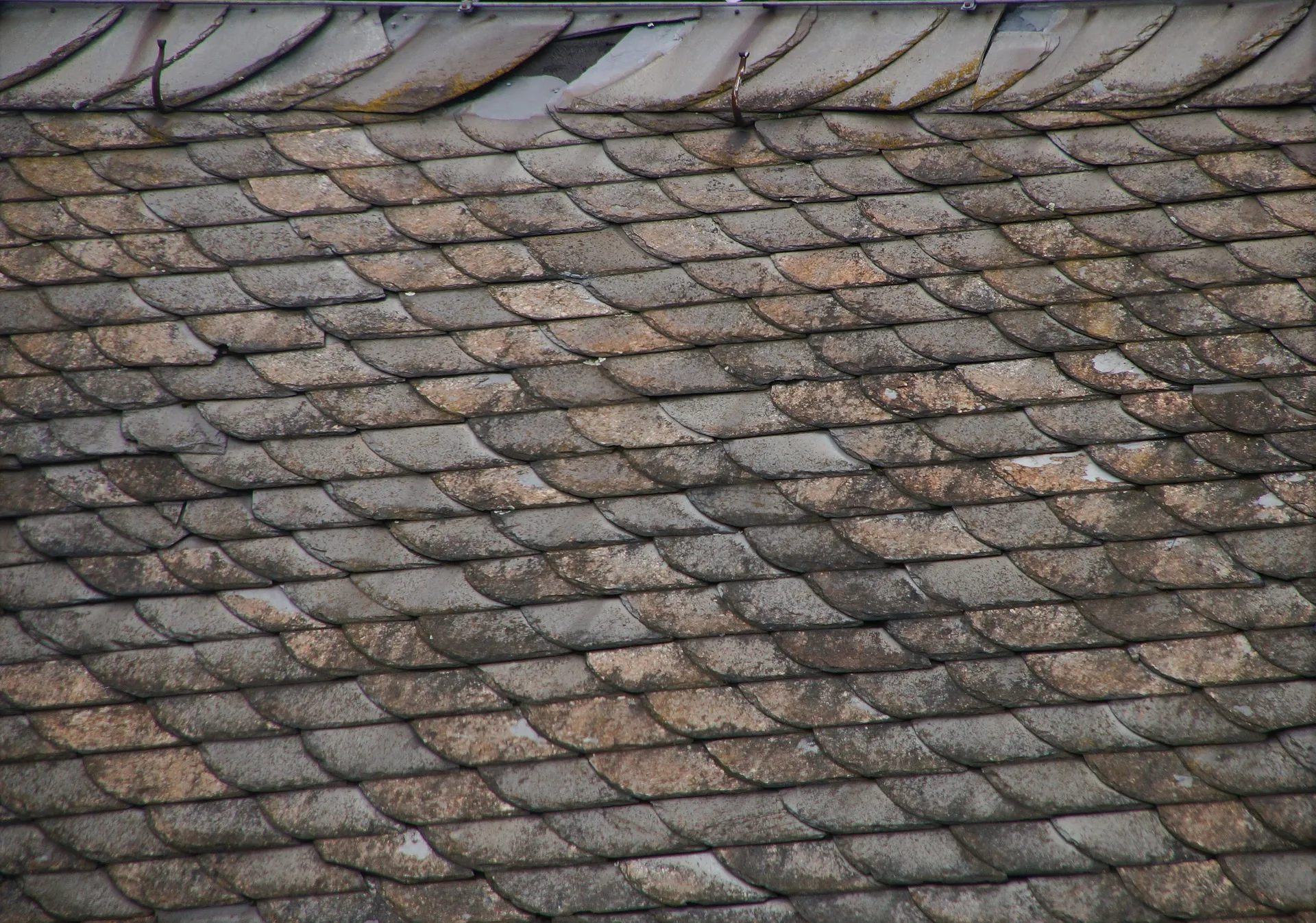 Damaged slate roof repair