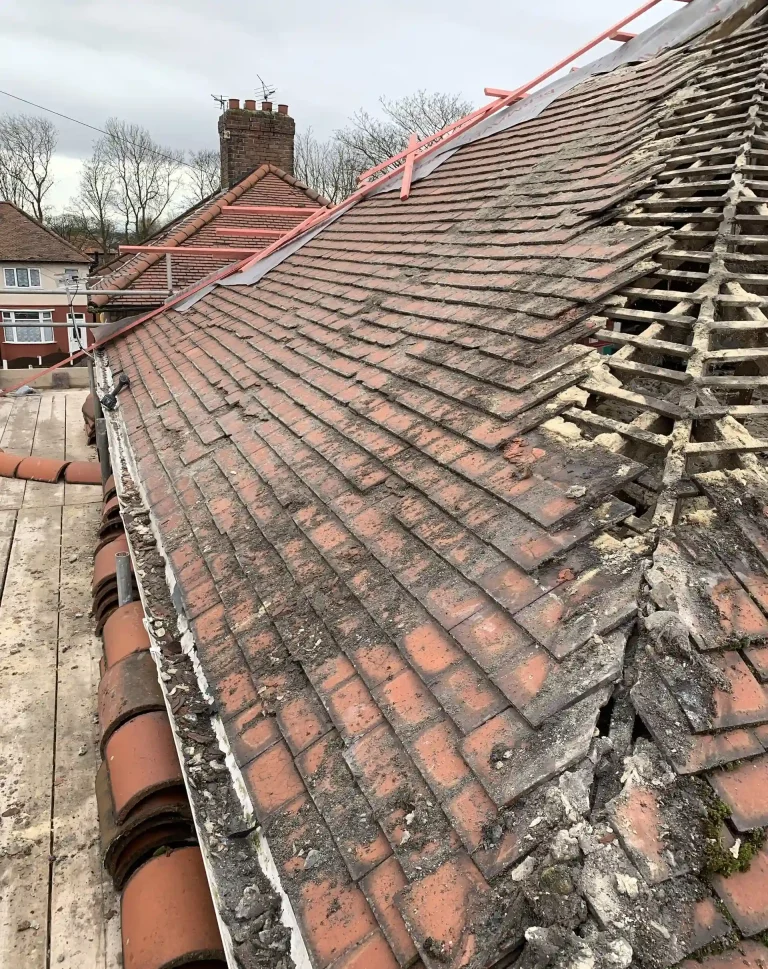 Weathered tiled roof with visible defects
