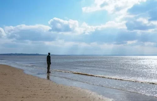 Another Place statue on Crosby beach
