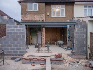 Rear house extension under construction with steel beams in place