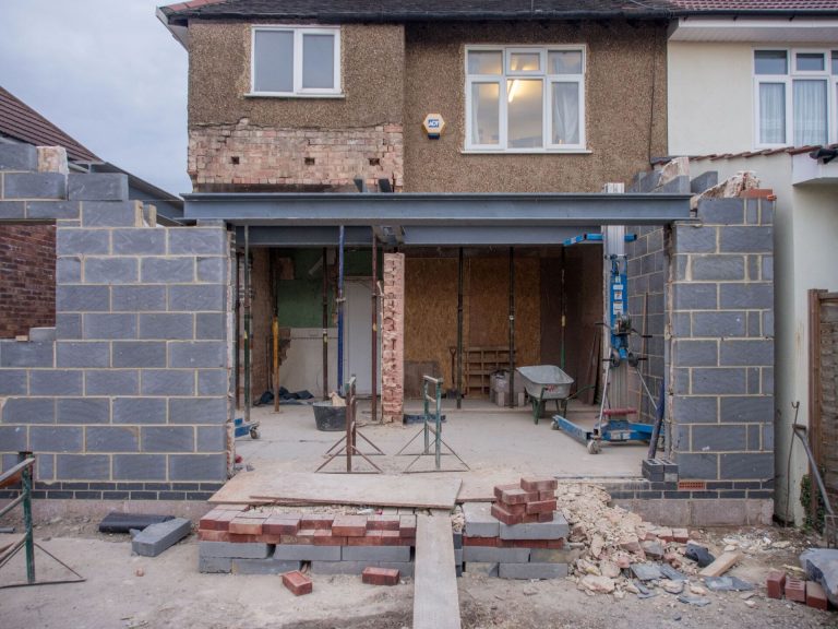 Rear house extension under construction with steel beams in place